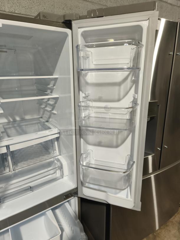 LG 21.8 cu ft French Door Refrigerator, Model LFDS22520S/06, new condition, external water dispenser, interior shelves and bins.
