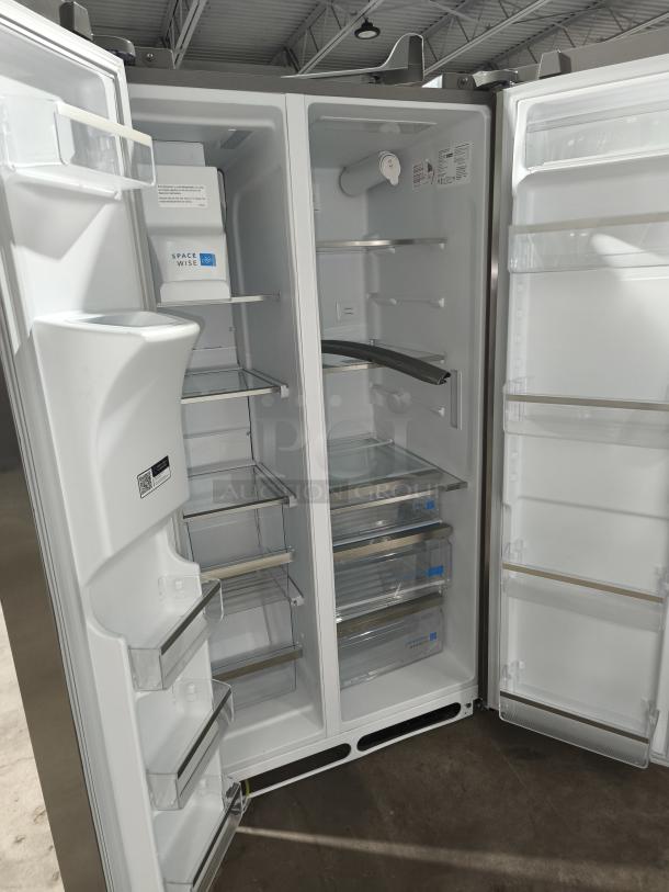 Frigidaire Gallery 25.6 cu ft side-by-side refrigerator, model GRSS2652AFA, new condition, spacious interior, adjustable shelves.