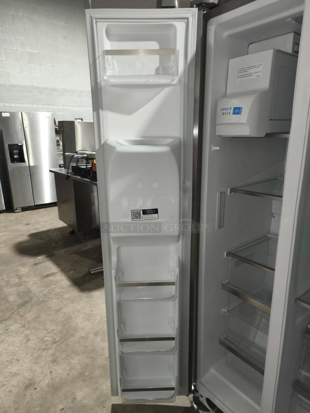 Frigidaire Gallery 25.6 cu ft side-by-side refrigerator, model GRSS2652AFA, new condition, interior view with shelves and SpaceWise feature.