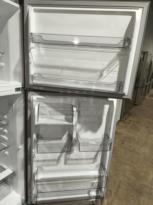 Midea 18.1 cu ft top-freezer refrigerator model MRT18D3BST, garage-ready, new condition, featuring clear door bins.