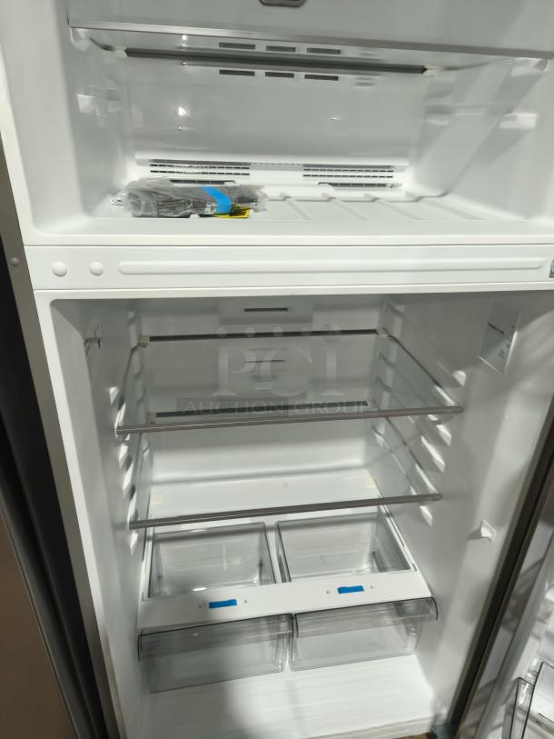 NEW Midea 18.1 cu ft top-freezer fridge, model MRT18D3BST. Spacious interior, adjustable shelves, clear crisper drawers.
