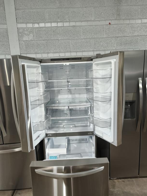 NEW LG 22 cu ft French Door Refrigerator, model LFCS2250S/07, 30-inch width, stainless steel, open doors, pristine condition.