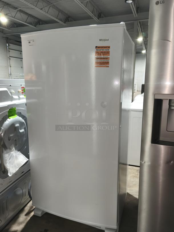 NEW Whirlpool 20 cu. ft. Upright Freezer, Model WZF34X20DW06, with LED lighting, new condition, registration label visible.