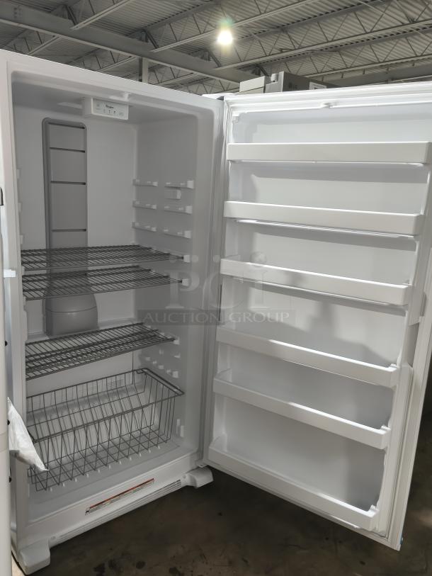 Whirlpool 20 cu. ft. upright freezer, model WZF34X20DW06, in new condition. Features LED lighting, multiple shelves, and storage bins.