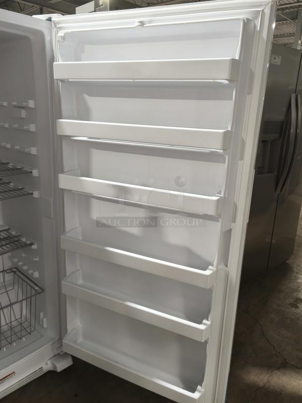 Whirlpool 20 cu. ft. upright freezer, model WZF34X20DW06, new condition with LED lighting and ample shelving space.