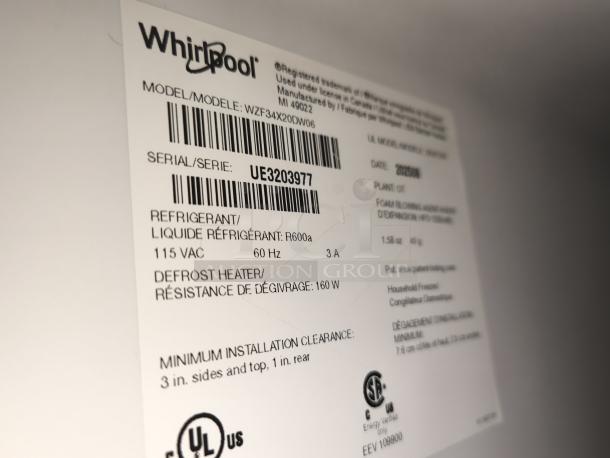 Label of Whirlpool upright freezer, model WZF34X20DW06, serial UE3203977, displaying specifications and safety certifications.