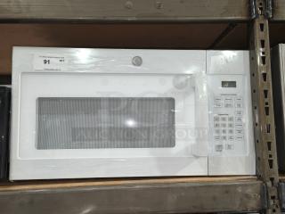 New GE 1.6 cu ft over-the-range microwave oven, model JVM3160DF9WW, pristine condition, white finish, features digital display and control panel.