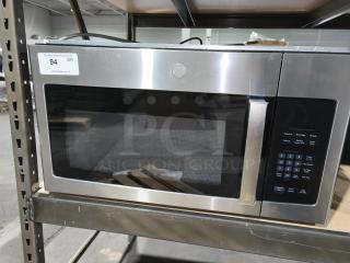 BRAND NEW SCRATCH AND DENT GE 1.6 cu ft over-the-range microwave, model JVM3162RJSS, stainless steel, item tag #94 visible.