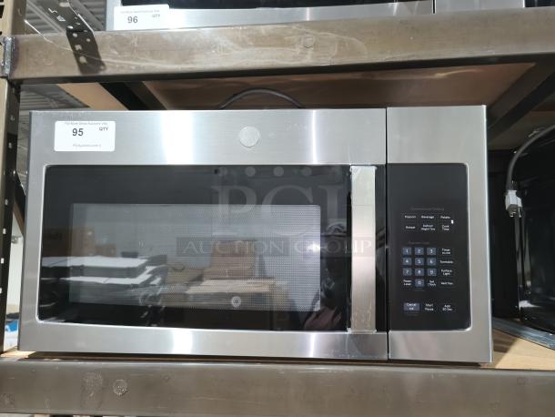 BRAND NEW GE 1.6 cu ft Over-the-Range Microwave Oven, model JVM3162RJSS, stainless steel, minor scratches, keypad visible.