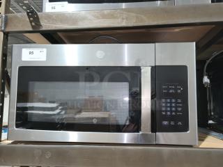 BRAND NEW GE 1.6 cu ft Over-the-Range Microwave Oven, model JVM3162RJSS, stainless steel, minor scratches, keypad visible.