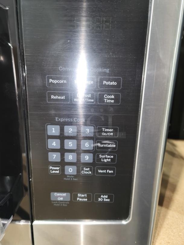 Brand new GE 1.6 cu ft over-the-range microwave model JVM3162RJSS with scratch and dent. Stainless steel, keypad detail shown.