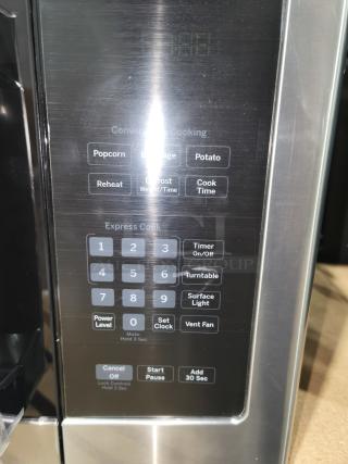 Brand new GE JVM3162RJSS 1.6 cu ft over-the-range microwave oven panel, featuring convenient preset options.