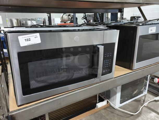 BRAND NEW GE 1.6 cu ft over-the-range microwave, model JVM3162RJSS. Scratch and dent condition. Model label visible.