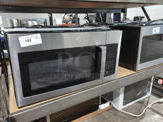 BRAND NEW GE 1.6 cu ft over-the-range microwave, model JVM3162RJSS. Scratch and dent condition. Model label visible.