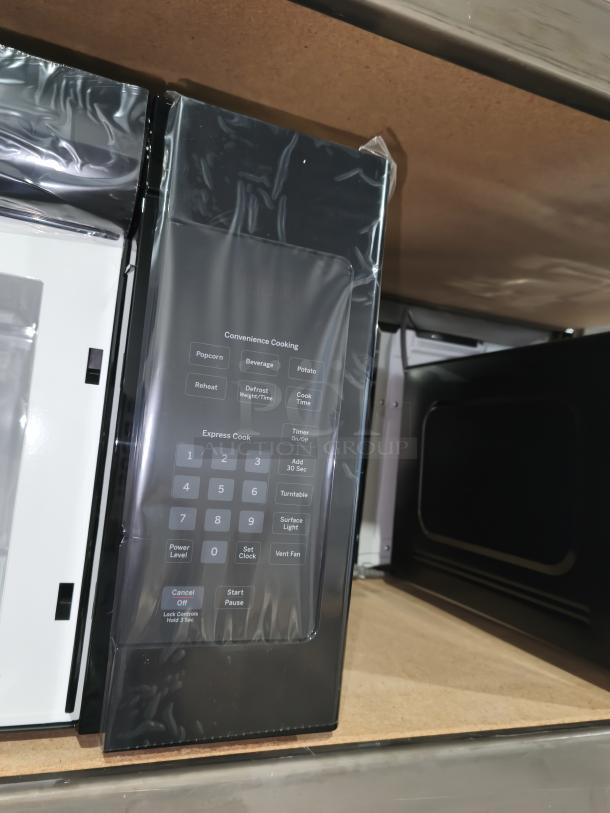 BRAND NEW GE JVM3160DFBB 1.6 cu ft Over-the-Range Microwave, black, minor scratches, control panel with cooking options visible.