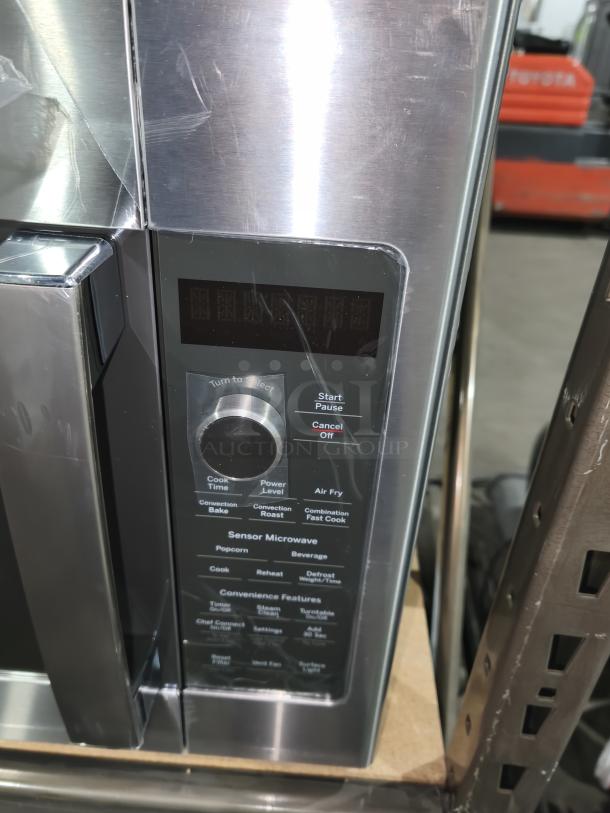 BRAND NEW Scratch and Dent GE Profile PVM9179SRSS 1.7 cu ft Convection Microwave Oven. Stainless steel, control panel visible.