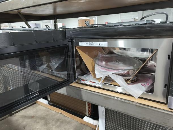 BRAND NEW GE Profile 1.7 cu ft Convection Over-the-Range Microwave Oven, Model PVM9179SRSS. Minor scratches and dents visible.