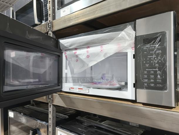 GE Over-the-Range Sensor Microwave Oven JVM617YK6FS, brand new, minor scratches, interior wrapped packaging visible.
