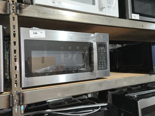 Brand new GE 1.7 cu ft over-the-range sensor microwave, model JVM6175YK6FS, stainless steel, scratch and dent condition, on warehouse shelf.