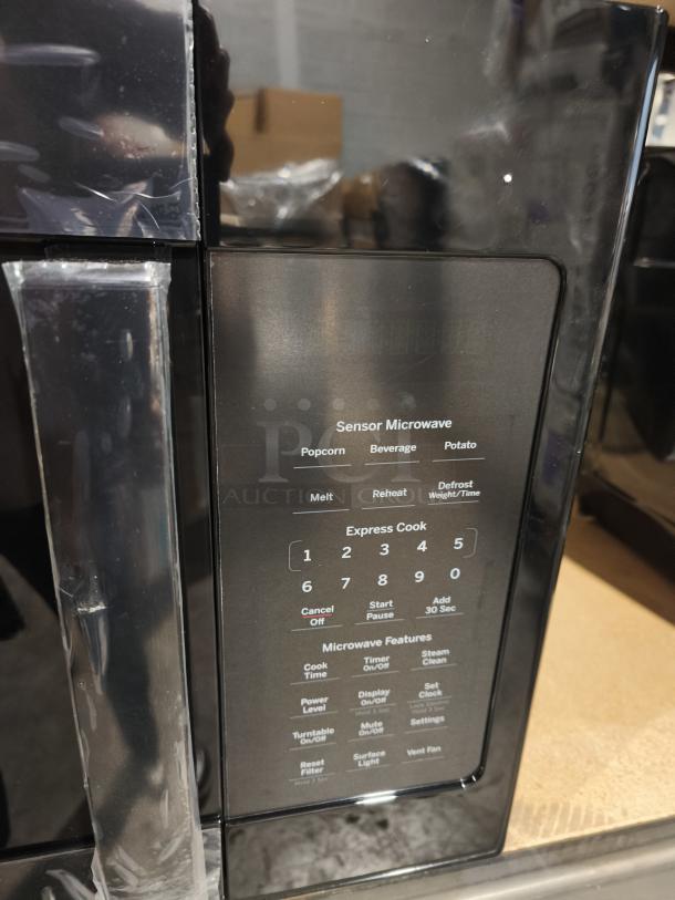 BRAND NEW GE 1.9 cu ft Over-the-Range Sensor Microwave Oven, Model JVM7195DKBB, scratch and dent condition, black finish.