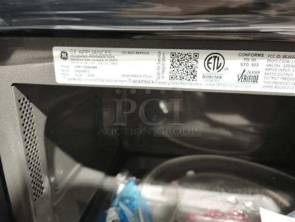 BRAND NEW GE 1.9 cu ft Over-the-Range Sensor Microwave Oven, model JVM7195DKBB, scratch and dent condition, label shown.
