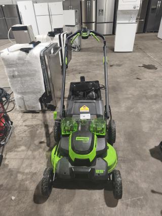 Greenworks 80V 25" self-propelled cordless mower, Model LMB405. Tested and working, features dual battery slots, visible wear on wheels.