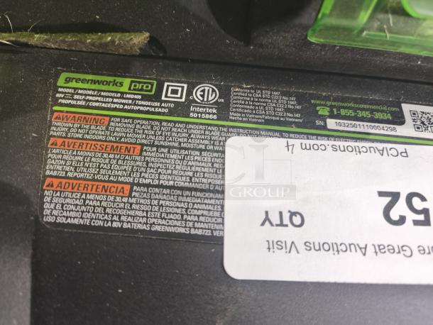 Greenworks 80V 25" self-propelled cordless mower, model LMB405. Tested and working. Warning labels and serial number visible.