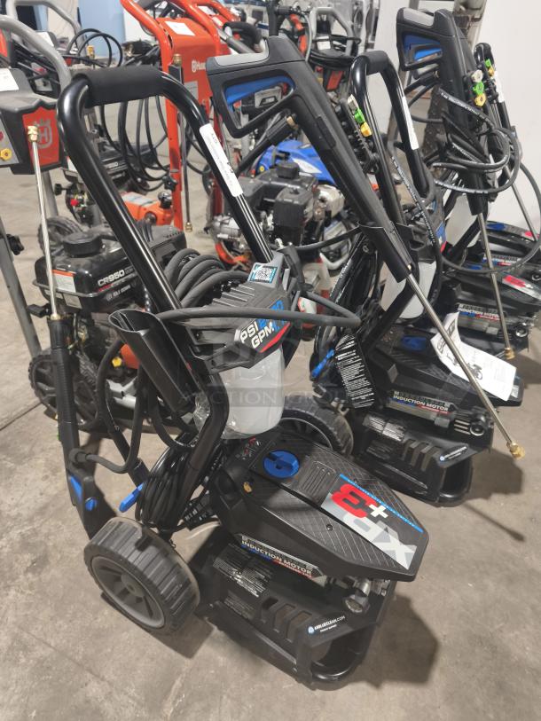 AR Blue Clean XP3-2400 Electric Pressure Washer, tested and working, features durable wheels, hose, and spray nozzles.