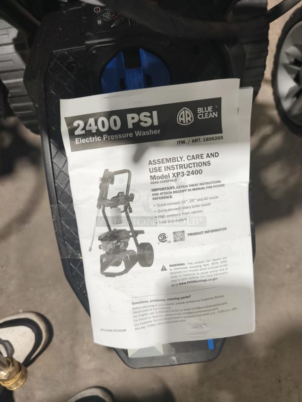 AR Blue Clean XP3-2400 Electric Pressure Washer, tested and working, 2400 PSI, includes manual, shown on textured black base.