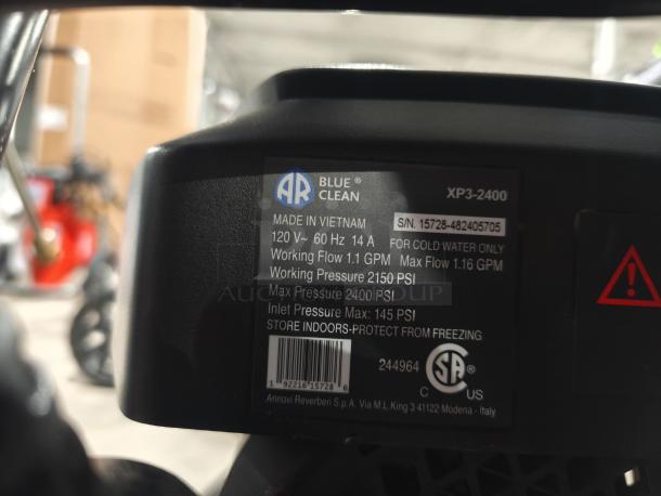 AR Blue Clean XP3-2400 electric pressure washer label, shows specifications: 120V, 14A, 2150 PSI working pressure, made in Vietnam.