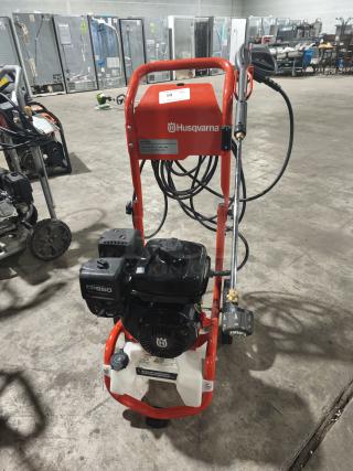 Husqvarna PW 3200 pressure washer, 3200 PSI, tested and working, red frame, CR950 engine, visible brand logos, clean condition.