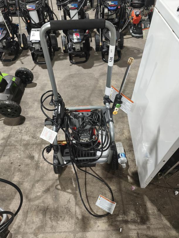 Husqvarna PW2300 Electric Pressure Washer, gray, includes hose and nozzle attachments. Light wear visible, tag: "126 QT."