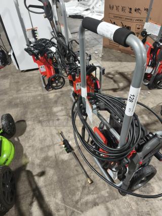 Husqvarna PW2300 electric pressure washer, coiled hose, and metal spray wand. Excellent condition; model labels visible.
