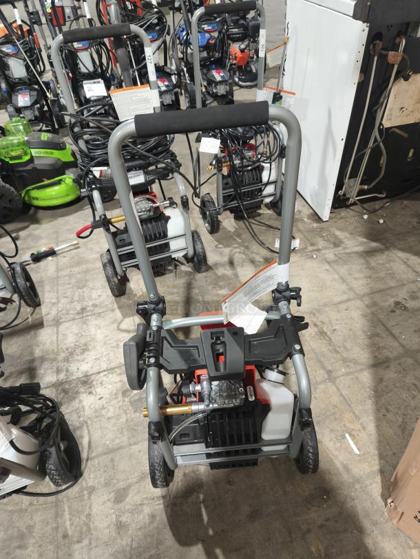 Husqvarna PW2300 electric pressure washer, tested and working, with sturdy frame, visible hoses, and intact labels.