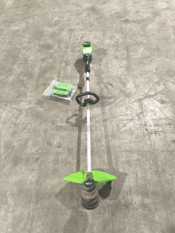 Greenworks Pro STB409 80V 16-inch cordless string trimmer. Tested, working condition, includes battery and charger.
