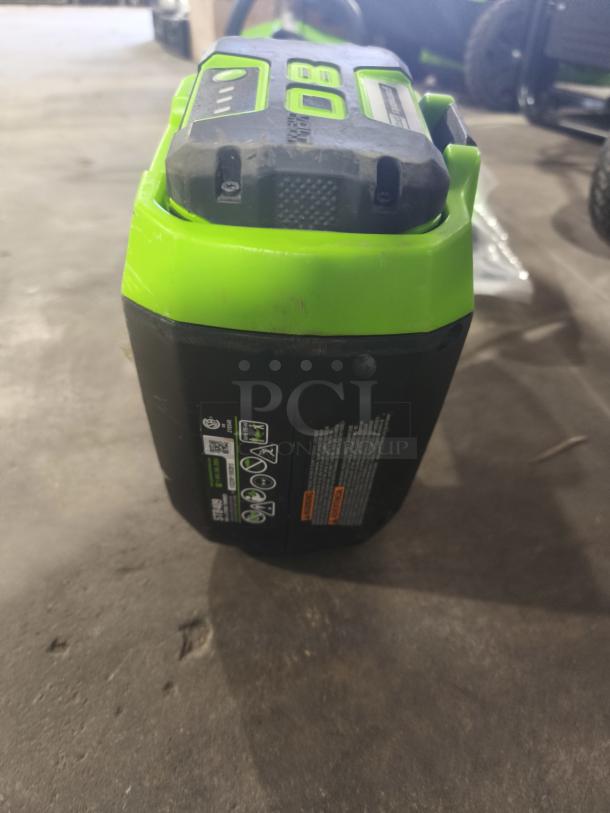 Greenworks Pro STB409 80V cordless string trimmer, 16-inch, tested and working. Features bright green casing, visible labels.