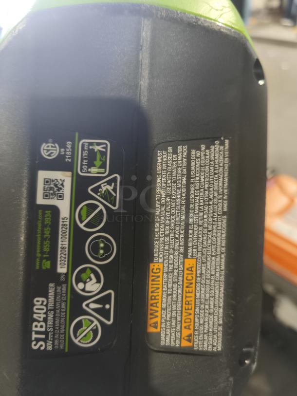 Greenworks Pro STB409 80V 16-inch Cordless String Trimmer, tested and working. Model and safety labels visible.
