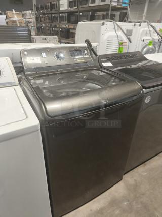 GE 5.0 cu ft top-load washer with steam function, model GTWS8655D0MC, in good condition. Features SmartDispense.
