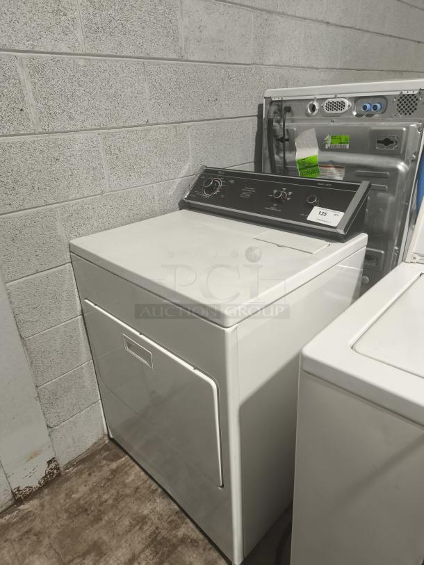 Whirlpool top-load electric dryer, model LE7680XSW2, white, front controls, in good condition. Auction tag visible.