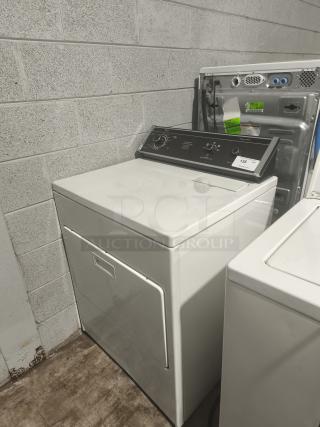 Whirlpool top-load electric dryer, model LE7680XSW2, white, front controls, in good condition. Auction tag visible.