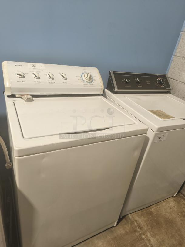 Kenmore top-load washing machine, model 11027721600, white, with control knobs and settings, in good used condition.