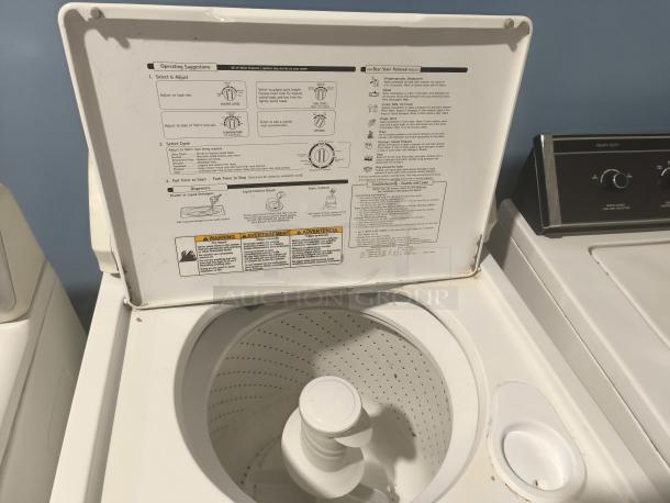 Kenmore top-load washing machine, model 11027721600, featuring a visible control panel with operating instructions. Good condition.