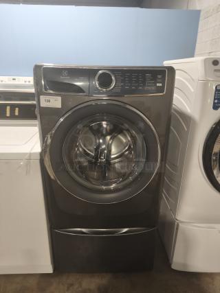 Electrolux ELFW7637 front-load washer, 4.5 cu ft, 600 Series, with SmartBoost and Perfect Steam features, in excellent condition.
