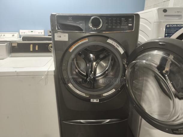 Electrolux ELFW7637 front-load washer, 4.5 cu ft, 600 Series, with SmartBoost and Perfect Steam features, door open.