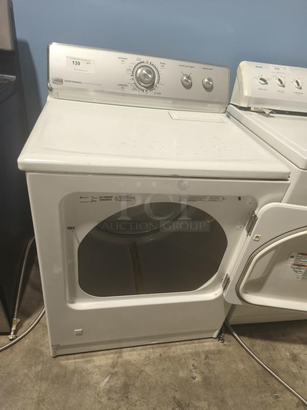 Maytag Dryer, Model MGDC400VW0 (Centennial). White finish, front-load, control panel with multiple settings. Good condition.