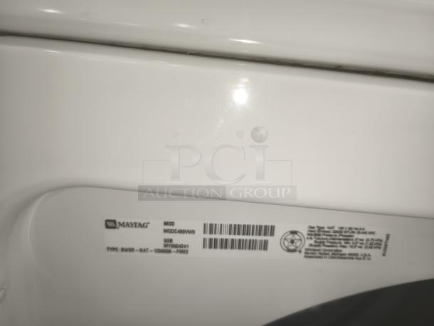 Maytag dryer model MGDC400VW0 label, showcasing model and serial number. Model: MGDC400VW0, serial: MV5064421.