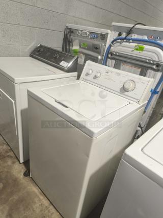 Estate direct-drive top-load washer, model TAWB600DQ0, in good condition. Features dials and control panel.
