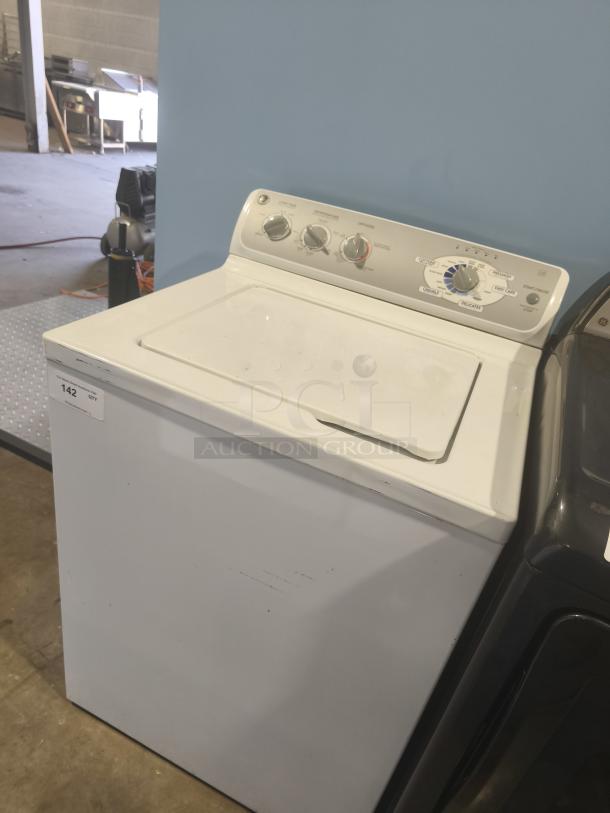 GE 4.1 cu ft top-load washer, model WHRE5550K2WW. Excellent condition with visible controls and settings.