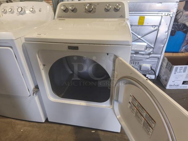 Maytag 7.0 cu ft electric dryer, model MEDX655DW1, with sanitize cycle and IntelliDry® sensor. Door open, in good condition.