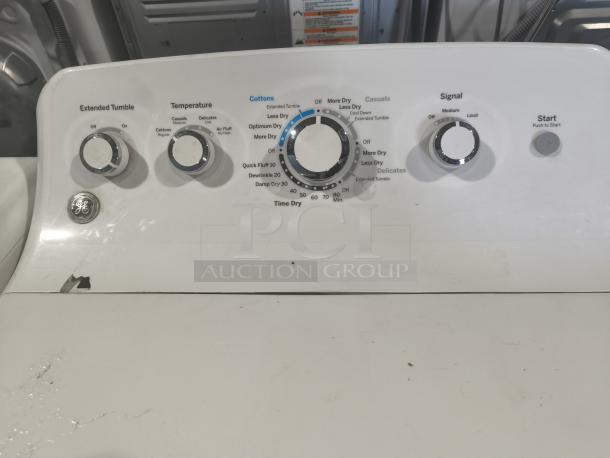 GE® 7.2 cu. ft. electric dryer, model GTD42EASJ2WW, featuring control knobs for tumble, temperature, and signal in fair condition.